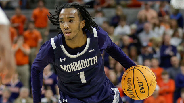 AUBURN, ALABAMA - DECEMBER 30: Abdi Bashir Jr. #1 of the Monmouth Hawks dribbles the ball during the first half against the Auburn Tigers at Neville Arena on December 30, 2024 in Auburn, Alabama.
