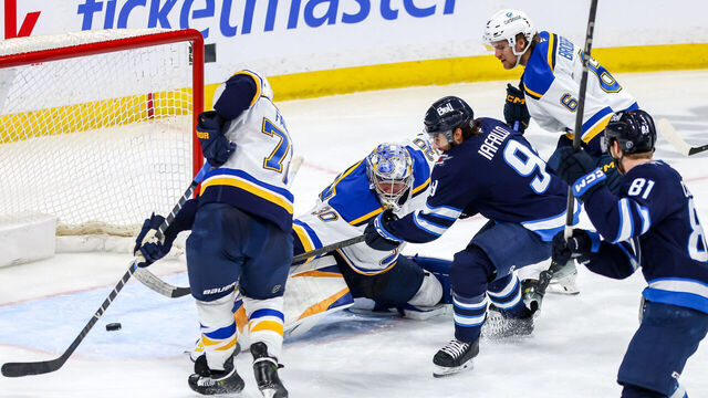 WINNIPEG, CANADA - APRIL 7: Alex Iafallo #9 of the Winnipeg Jets shoots the puck past goaltender Joel Hofer #30 of the St. Louis Blues and into the open net for a third period goal at the Canada Life Centre on April 7, 2025 in Winnipeg, Manitoba, Canada.