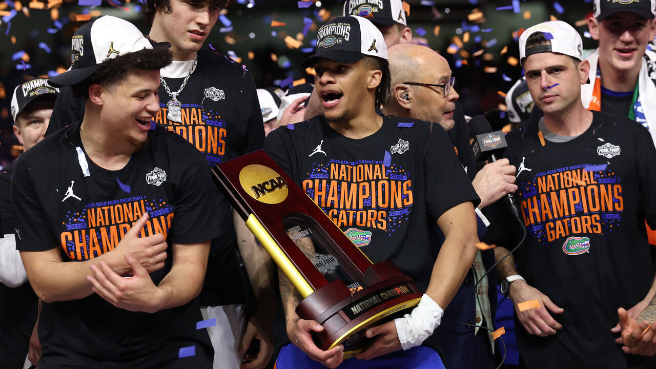 SAN ANTONIO, TEXAS - APRIL 07: Alijah Martin #15 of the Florida Gators celebrates with the trophy after defeating the Houston Cougars in the National Championship of the NCAA Men's Basketball Tournament at the Alamodome on April 07, 2025 in San Antonio, Texas.