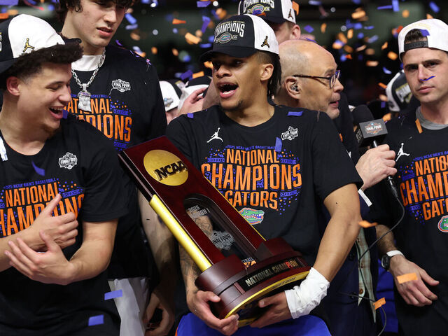 SAN ANTONIO, TEXAS - APRIL 07: Alijah Martin #15 of the Florida Gators celebrates with the trophy after defeating the Houston Cougars in the National Championship of the NCAA Men's Basketball Tournament at the Alamodome on April 07, 2025 in San Antonio, Texas.