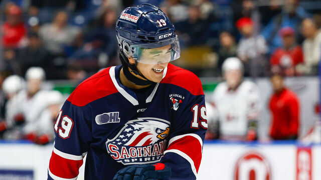 SAGINAW, MI - DECEMBER 29: Zayne Parekh #19 of Saginaw is all smiles during a game between Niagara Ice Dogs and Saginaw Spirit at Dow Event Center on December 29, 2024 in Saginaw, Michigan.