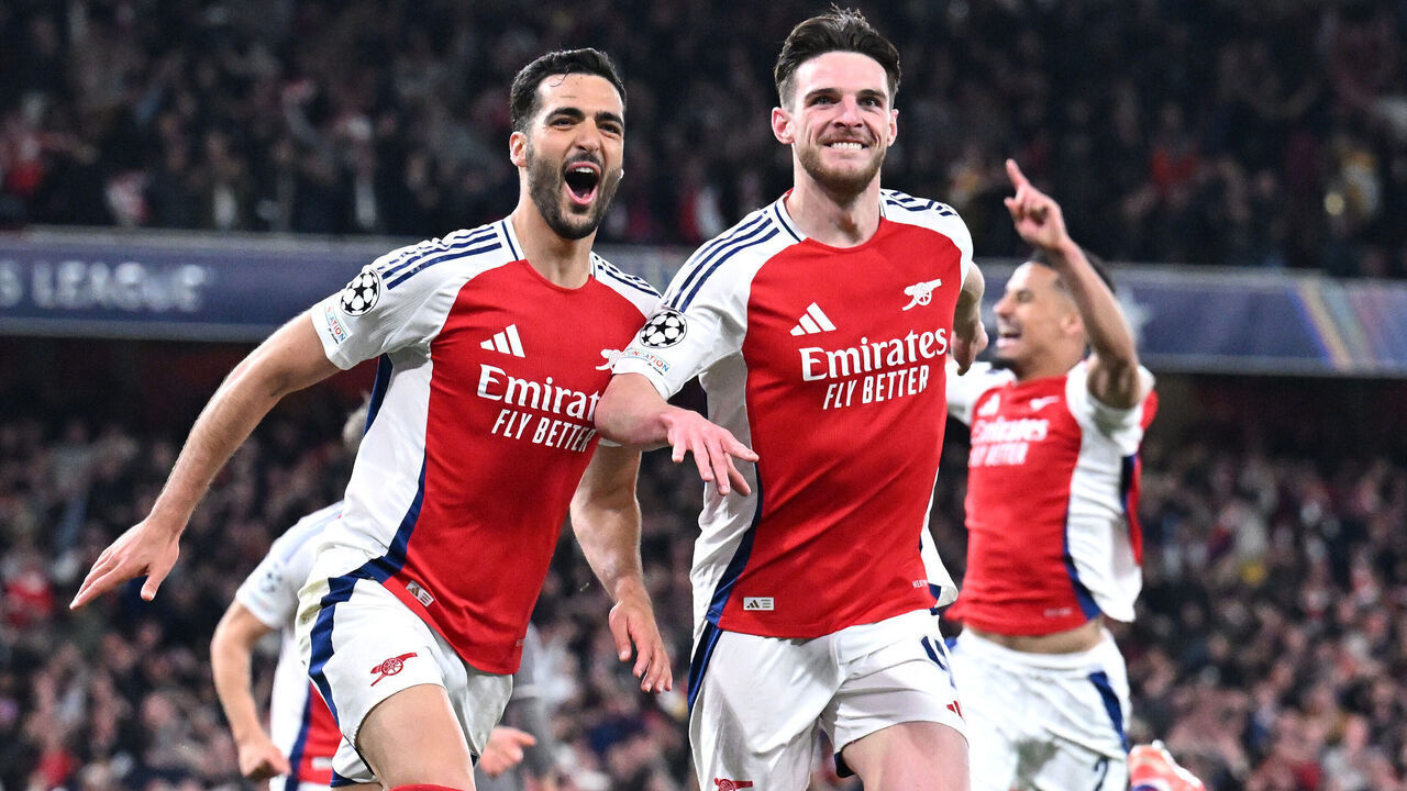 LONDON, ENGLAND - APRIL 08: Mikel Merino of Arsenal celebrates scoring his team's third goal with teammate Declan Rice during the UEFA Champions League 2024/25 Quarter Final First Leg match between Arsenal FC and Real Madrid C.F. at Emirates Stadium on April 08, 2025 in London, England.