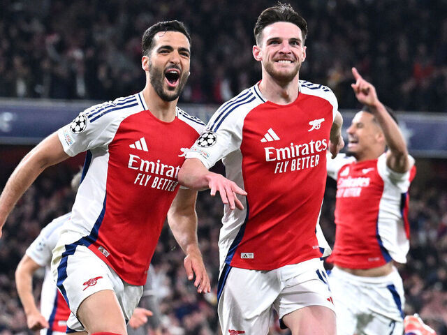 LONDON, ENGLAND - APRIL 08: Mikel Merino of Arsenal celebrates scoring his team's third goal with teammate Declan Rice during the UEFA Champions League 2024/25 Quarter Final First Leg match between Arsenal FC and Real Madrid C.F. at Emirates Stadium on April 08, 2025 in London, England.