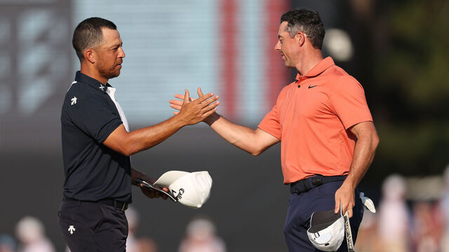 PINEHURST, NORTH CAROLINA - JUNE 13: Xander Schauffele of the United States and Rory McIlroy of Northern Ireland shake hands on the 18th green during the first round of the 124th U.S. Open at Pinehurst Resort on June 13, 2024 in Pinehurst, North Carolina.