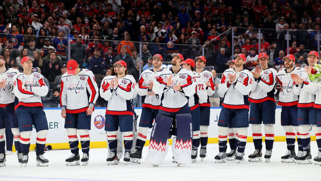 ELMONT, NEW YORK - APRIL 06: Anthony Beauvillier #72 of the Washington Capitals and teammates react during the celebration after Alex Ovechkin #8 scores his 895th career goal during the second period against the New York Islanders at UBS Arena on April 06, 2025 in Elmont, New York. Ovechkin's goal passes Gretzky's 894 goals to become the NHL all-time goal-scoring leader.