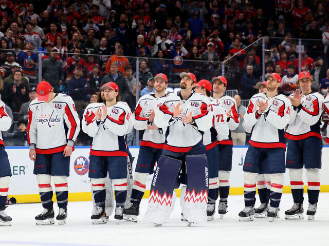 ELMONT, NEW YORK - APRIL 06: Anthony Beauvillier #72 of the Washington Capitals and teammates react during the celebration after Alex Ovechkin #8 scores his 895th career goal during the second period against the New York Islanders at UBS Arena on April 06, 2025 in Elmont, New York. Ovechkin's goal passes Gretzky's 894 goals to become the NHL all-time goal-scoring leader.