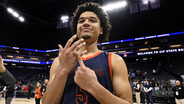 Sacramento, CA - March 15: Brayden Burries #5 of Roosevelt Mustangs points to the ring finger as the Roosevelt Mustangs defeated Archbishop Riordan Crusaders 80-60 to win a boys CIF State Open Division championship basketball game at the Golden 1 Center in Sacramento on Saturday, March 15, 2025.