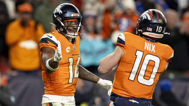 DENVER, COLORADO - DECEMBER 15: Courtland Sutton #14 of the Denver Broncos celebrates with Bo Nix #10 of the Denver Broncos during an NFL Football game against the Indianapolis Colts at Empower Field At Mile High on December 15, 2024 in Denver, Colorado.