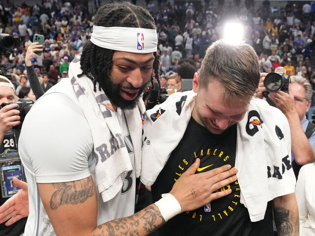 DALLAS, TX - APRIL 9: Anthony Davis #3 of the Dallas Mavericks and Luka Doncic #77 of the Los Angeles Lakers talk after the game between the Los Angeles Lakers and the Dallas Mavericks on April 9, 2025 at American Airlines Center in Dallas, Texas. Mandatory Copyright Notice: Copyright 2025 NBAE