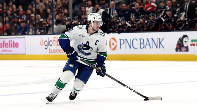 COLUMBUS, OHIO - MARCH 28: Quinn Hughes #43 of the Vancouver Canucks controls the puck during the game against the Columbus Blue Jackets at Nationwide Arena on March 28, 2025 in Columbus, Ohio. Columbus defeated Vancouver 7-6 in a shootout.