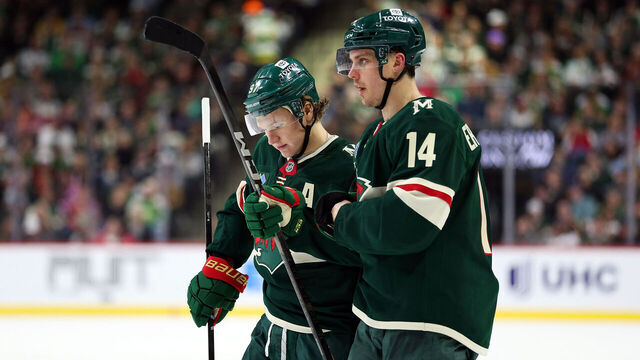 ST PAUL, MINNESOTA - APRIL 09: Kirill Kaprizov #97 and Joel Eriksson Ek #14 of the Minnesota Wild look on against the San Jose Sharks in the second period at Xcel Energy Center on April 09, 2025 in St Paul, Minnesota.