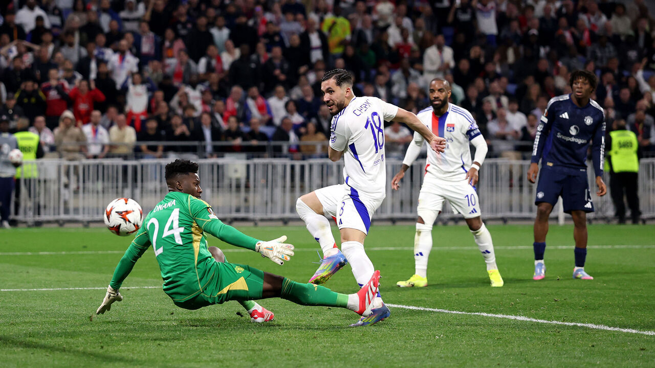 DECINES-CHARPIEU, FRANCE - APRIL 10: Rayan Cherki of Olympique Lyonnais scores his team's second goal past Andre Onana of Manchester United during the UEFA Europa League 2024/25 Quarter Final First Leg match between Olympique Lyonnais and Manchester United at OL Stadium on April 10, 2025 in Decines-Charpieu, France.