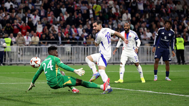 DECINES-CHARPIEU, FRANCE - APRIL 10: Rayan Cherki of Olympique Lyonnais scores his team's second goal past Andre Onana of Manchester United during the UEFA Europa League 2024/25 Quarter Final First Leg match between Olympique Lyonnais and Manchester United at OL Stadium on April 10, 2025 in Decines-Charpieu, France.