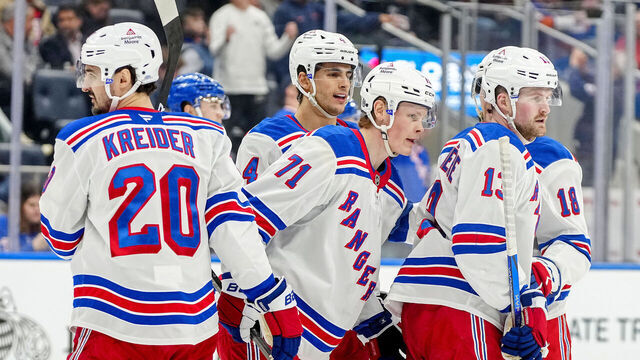 ELMONT, NEW YORK - APRIL 10: Juuso Parssinen #71 of the New York Rangers is congratulated by his teammates after scoring a goal against the New York Islanders during the second period at UBS Arena on April 10, 2025 in Elmont, New York.