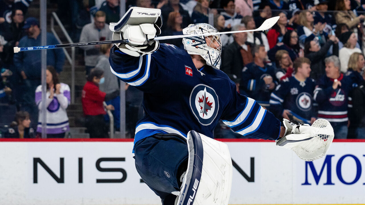 WINNIPEG, CANADA - APRIL 7: Connor Hellebuyck #37 of the Winnipeg Jets celebrate a 3-1 win against the St. Louis Blues at Canada Life Centre on April 7, 2025 in Winnipeg, Canada.