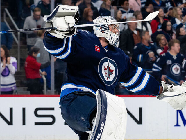 WINNIPEG, CANADA - APRIL 7: Connor Hellebuyck #37 of the Winnipeg Jets celebrate a 3-1 win against the St. Louis Blues at Canada Life Centre on April 7, 2025 in Winnipeg, Canada.