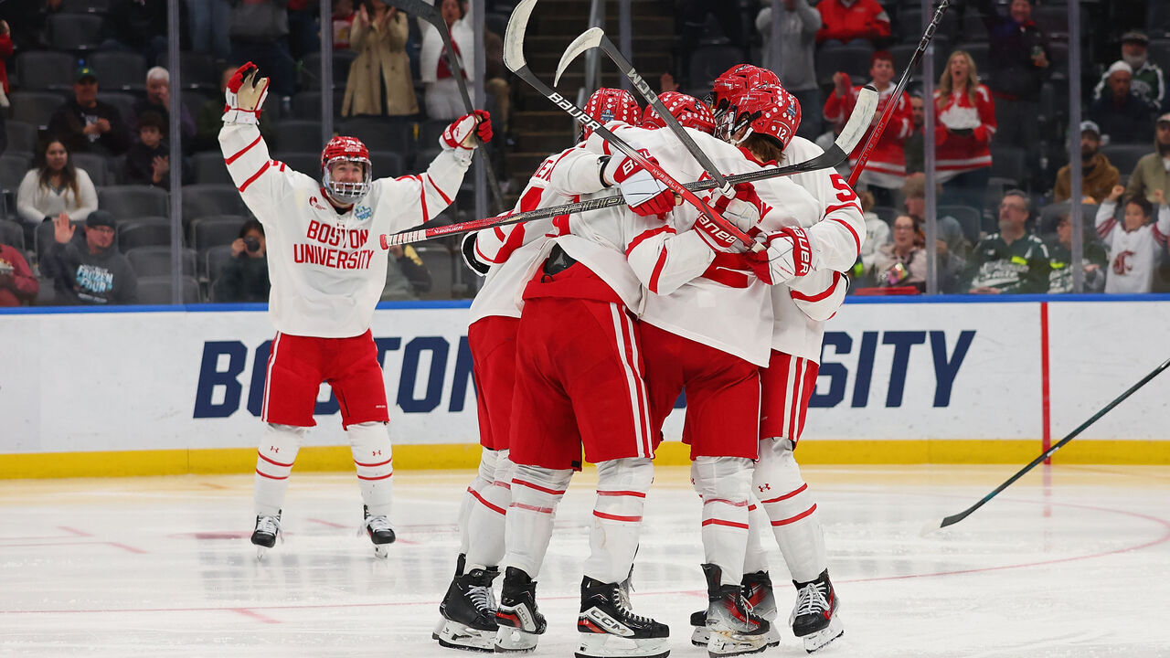 ST LOUIS, MISSOURI - APRIL 10: Members of the Boston University Terriers celebrate after scoring a goal against the Penn State Nittany Lions in the second period at Enterprise Center on April 10, 2025 in St Louis, Missouri.