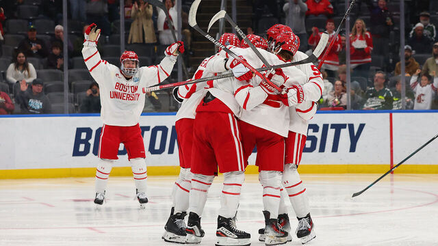 ST LOUIS, MISSOURI - APRIL 10: Members of the Boston University Terriers celebrate after scoring a goal against the Penn State Nittany Lions in the second period at Enterprise Center on April 10, 2025 in St Louis, Missouri.