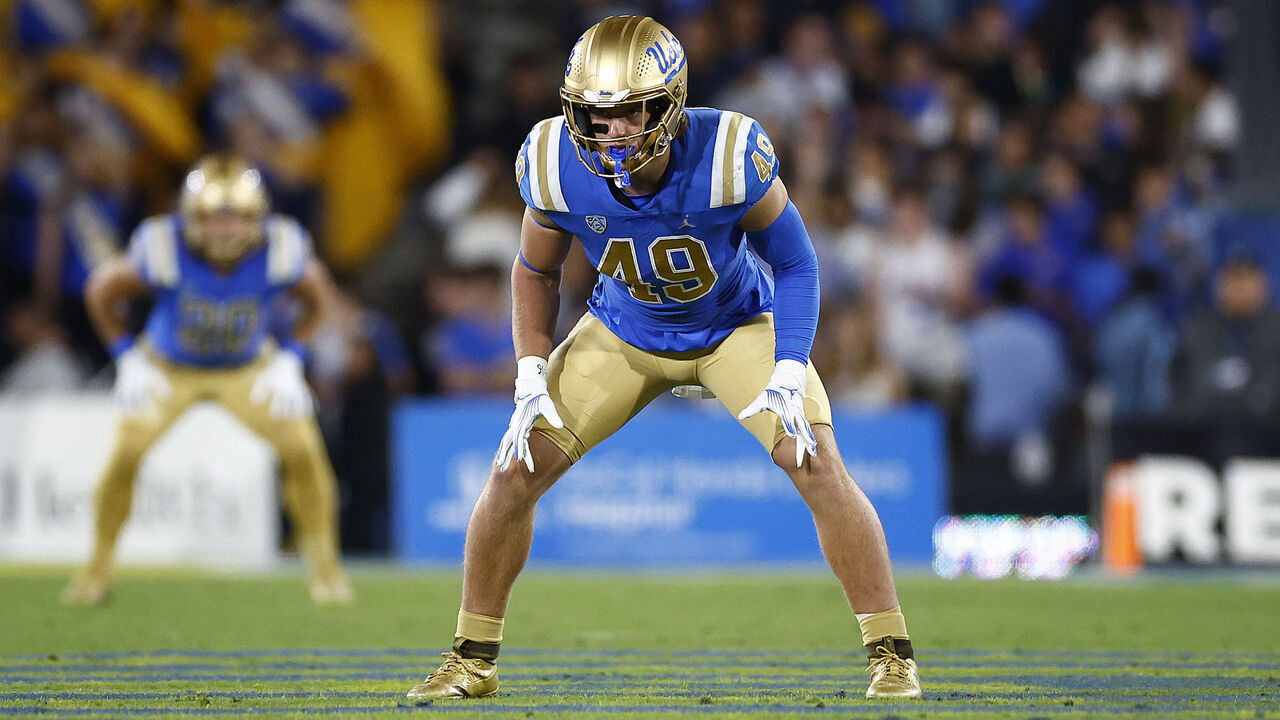 PASADENA, CALIFORNIA - NOVEMBER 11: Carson Schwesinger #49 of the UCLA Bruins at Rose Bowl Stadium on November 11, 2023 in Pasadena, California.