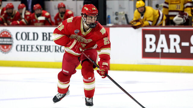 TEMPE, ARIZONA - FEBRUARY 07: Zeev Buium #28 of University of Denver Pioneers skates with the puck against the Arizona State University Sun Devils at Mullett Arena on February 07, 2025 in Tempe, Arizona.