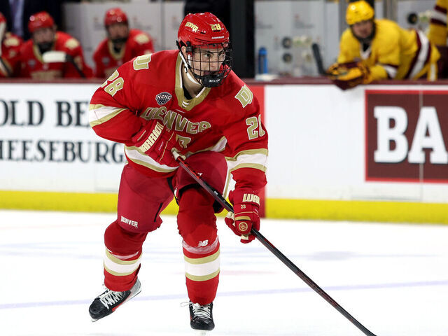 TEMPE, ARIZONA - FEBRUARY 07: Zeev Buium #28 of University of Denver Pioneers skates with the puck against the Arizona State University Sun Devils at Mullett Arena on February 07, 2025 in Tempe, Arizona.