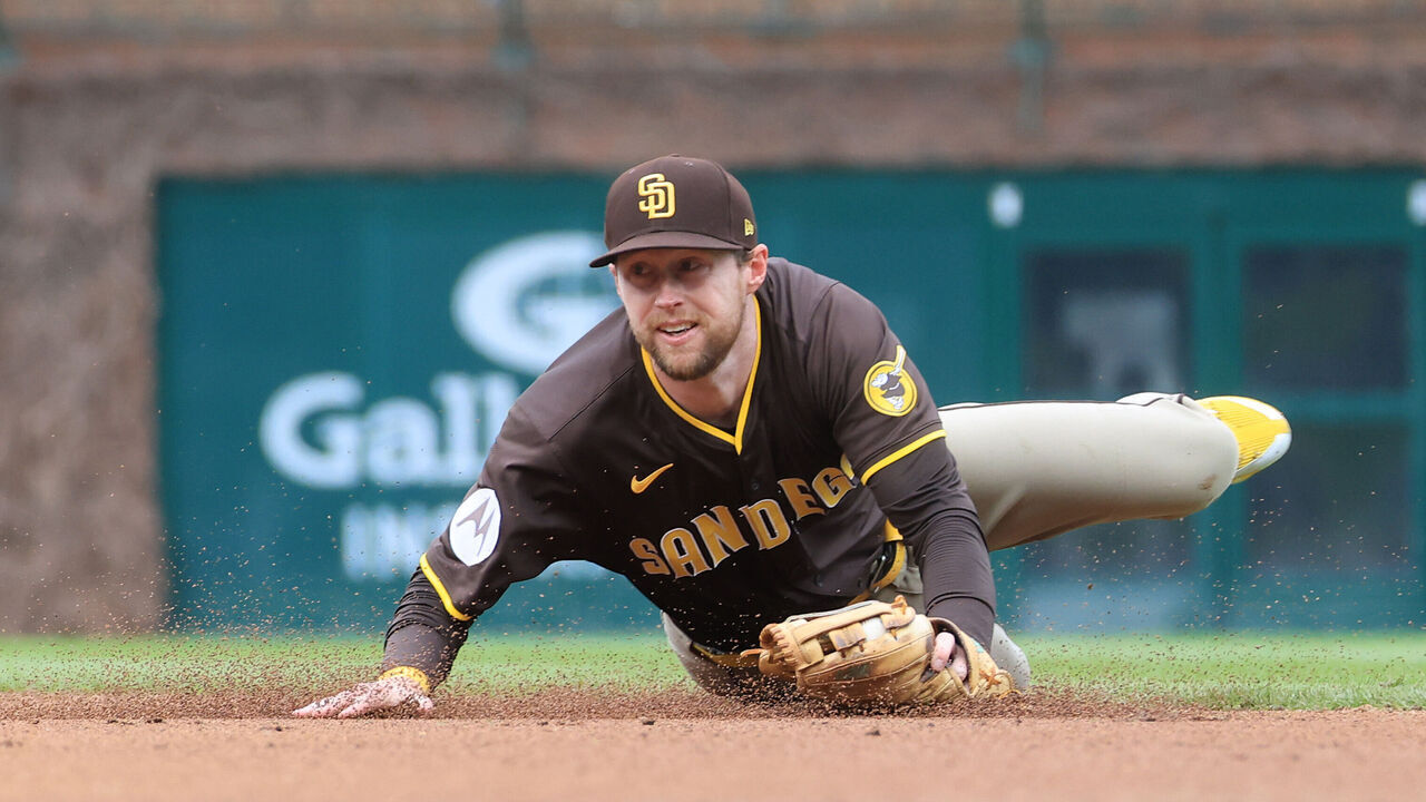 CHICAGO, ILLINOIS - APRIL 05: Jake Cronenworth #9 of the San Diego Padres fields the ball during the third inning against the Chicago Cubs at Wrigley Field on April 05, 2025 in Chicago, Illinois.