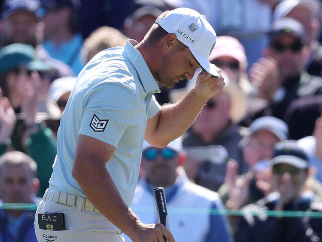 AUGUSTA, GEORGIA - APRIL 11: Bryson DeChambeau of the United States acknowledges the crowd on the second green during the second round of the 2025 Masters Tournament at Augusta National Golf Club on April 11, 2025 in Augusta, Georgia.