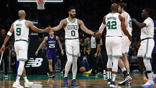 BOSTON, MA - APRIL 11: Jayson Tatum #0 of the Boston Celtics congratulates Derrick White #9, Al Horford #42, Luke Kornet #40 and Jrue Holiday #4 during the second half of their win over the Charlotte Hornets at TD Garden on April 11, 2025 in Boston, Massachusetts. NOTE TO USER: User expressly acknowledges and agrees that, by downloading and/or using this Photograph, user is consenting to the terms and conditions of the Getty Images License Agreement.