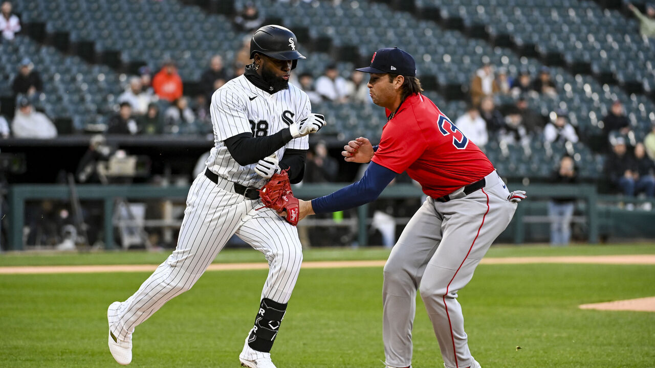 CHICAGO, ILLINOIS - APRIL 11: Triston Casas #36 of the Boston Red Sox tags out Luis Robert Jr. #88 of the Chicago White Sox at first base during the first inning at Rate Field on April 11, 2025 in Chicago, Illinois.