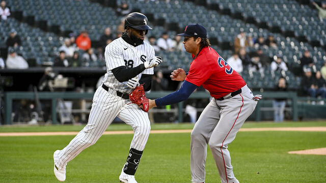 CHICAGO, ILLINOIS - APRIL 11: Triston Casas #36 of the Boston Red Sox tags out Luis Robert Jr. #88 of the Chicago White Sox at first base during the first inning at Rate Field on April 11, 2025 in Chicago, Illinois.