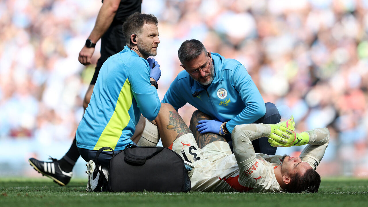 MANCHESTER, ENGLAND - APRIL 12: Ederson of Manchester City receives medical treatment after picking up an injury, before leaving the field to be replaced by substitute Stefan Ortega (not pictured), during the Premier League match between Manchester City FC and Crystal Palace FC at Etihad Stadium on April 12, 2025 in Manchester, England.