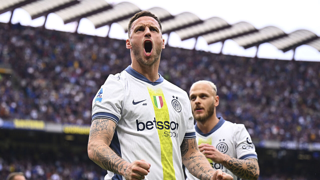 MILAN, ITALY - APRIL 12: Marko Arnautovic of FC Internazionale celebrates after scoring his team's opening goal during the Serie A match between FC Internazionale and Cagliari at Stadio Giuseppe Meazza on April 12, 2025 in Milan, Italy.