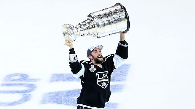 LOS ANGELES, CA - JUNE 13: Alec Martinez #27 of the Los Angeles Kings celebrates with the Stanley Cup after the Kings 3-2 double overtime victory against the New York Rangers in Game Five of the 2014 Stanley Cup Final at Staples Center on June 13, 2014 in Los Angeles, California.