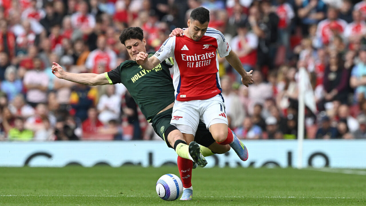 LONDON, ENGLAND - APRIL 12: Gabriel Martinelli of Arsenal is challenged by Christian Norgaard of Brentford during the Premier League match between Arsenal FC and Brentford FC at Emirates Stadium on April 12, 2025 in London, England.