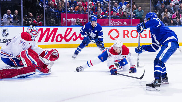 TORONTO, ON - APRIL 12: Mitch Marner #16 of the Toronto Maple Leafs scores an overtime winning goal against Jakub Dobes #75 of the Montreal Canadiens at the Scotiabank Arena on April 12, 2025 in Toronto, Ontario, Canada.