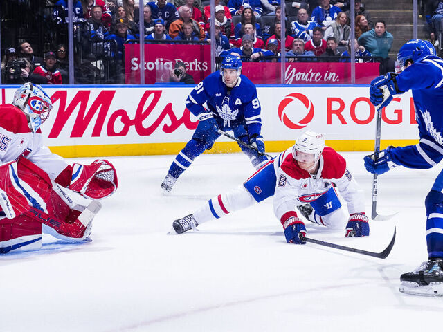 TORONTO, ON - APRIL 12: Mitch Marner #16 of the Toronto Maple Leafs scores an overtime winning goal against Jakub Dobes #75 of the Montreal Canadiens at the Scotiabank Arena on April 12, 2025 in Toronto, Ontario, Canada.