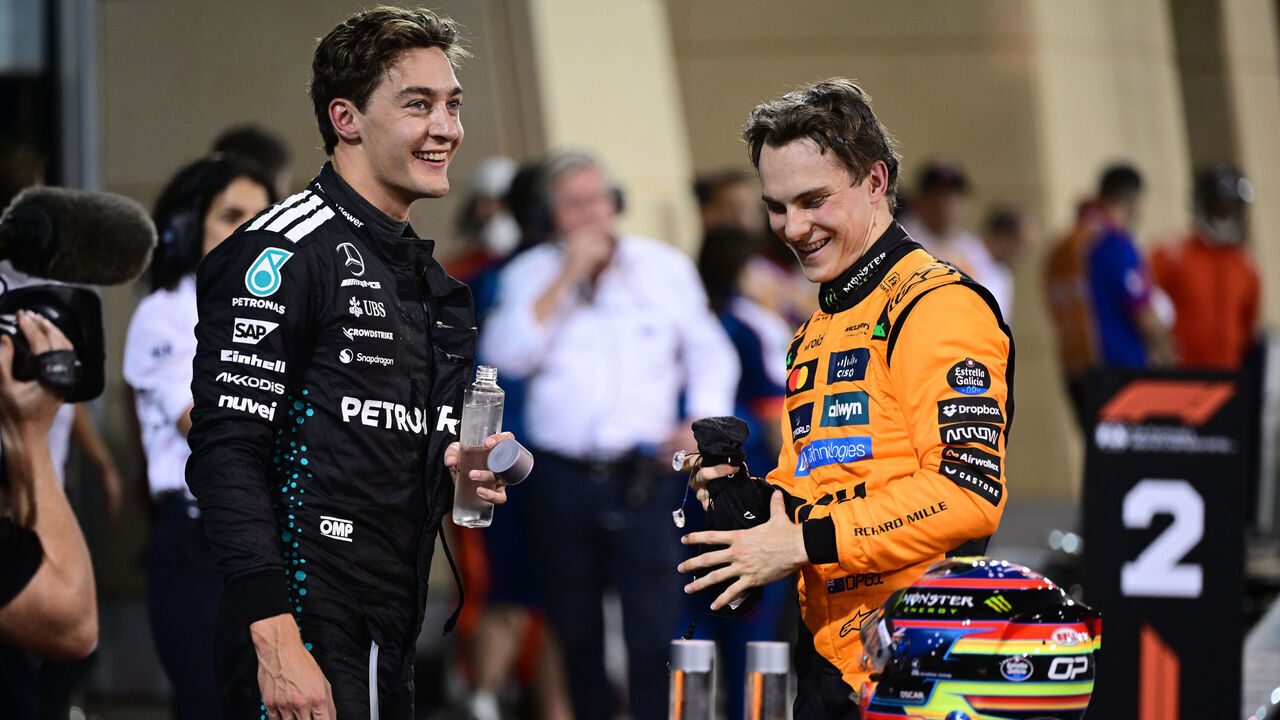Oscar Piastri of the McLaren F1 Team and George Russell of Mercedes-AMG Petronas celebrate during the qualifying of the Bahrain GP, the 4th round of the Formula 1 World Championship, at the Bahrain International Circuit in Sakhir, Bahrain, on April 12, 2025.