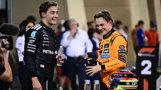 Oscar Piastri of the McLaren F1 Team and George Russell of Mercedes-AMG Petronas celebrate during the qualifying of the Bahrain GP, the 4th round of the Formula 1 World Championship, at the Bahrain International Circuit in Sakhir, Bahrain, on April 12, 2025.