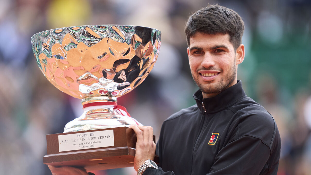 MONTE-CARLO, MONACO - APRIL 13: Carlos Alcaraz of Spain holds the trophy after winning the final of the singles between Carlos Alcaraz of Spain and Lorenzo Musetti of Italy during Day Eight of the Rolex Monte-Carlo Masters at Monte-Carlo Country Club on April 13, 2025 in Monte-Carlo, Monaco.
