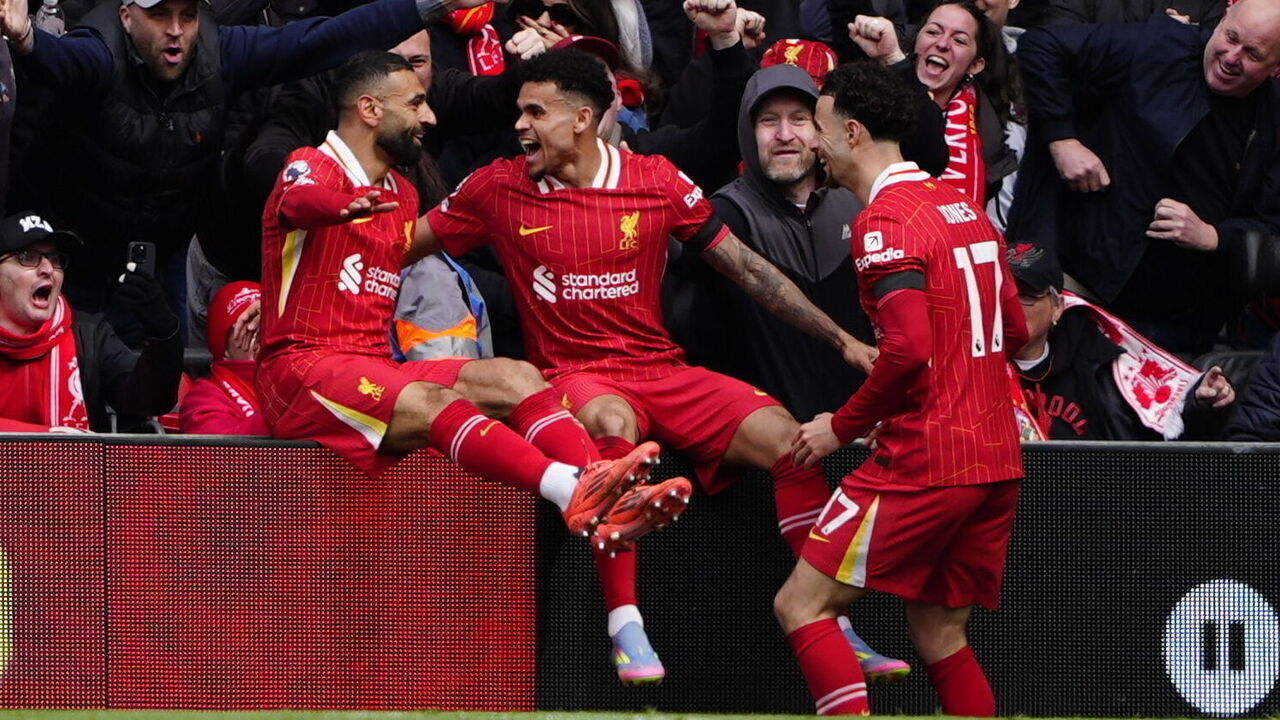 Liverpool's Luis Diaz (centre) celebrates with Mohamed Salah (left) and Curtis Jones (right) after scoring his sides first goal during the Premier League match at Anfield, Liverpool. Picture date: Sunday April 13, 2025.