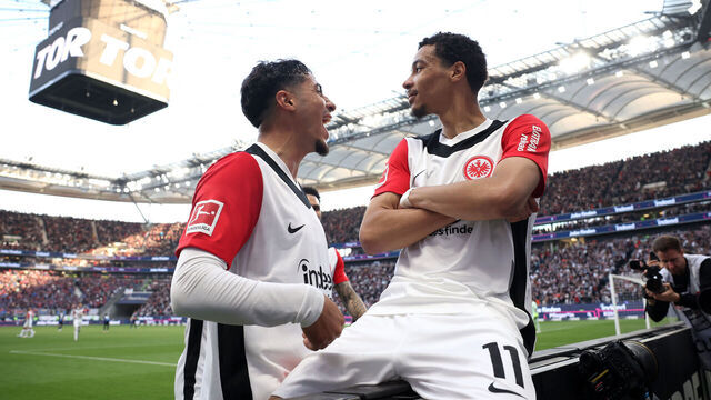 FRANKFURT AM MAIN, GERMANY - APRIL 13: Hugo Ekitike of Eintracht Frankfurt celebrates scoring his team's third goal with teammate Fares Chaibi during the Bundesliga match between Eintracht Frankfurt and 1. FC Heidenheim 1846 at Deutsche Bank Park on April 13, 2025 in Frankfurt am Main, Germany.