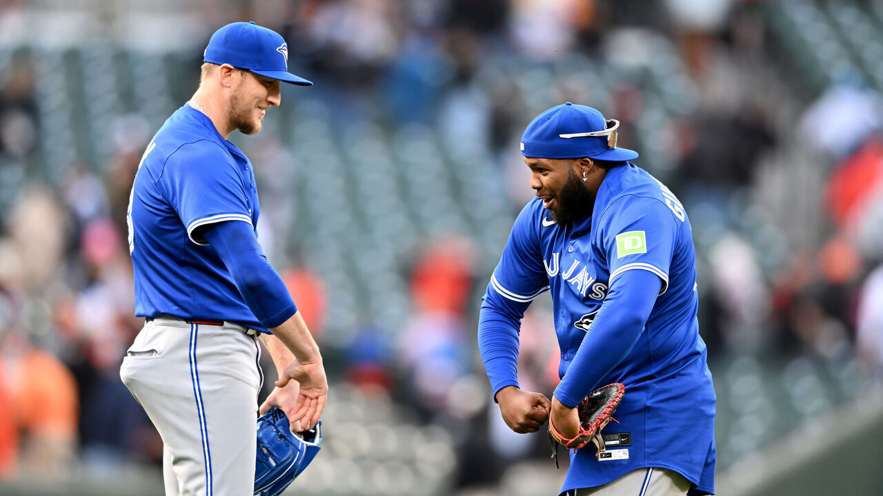 BALTIMORE, MARYLAND - APRIL 13: Jeff Hoffman #23 of the Toronto Blue Jays celebrates with Vladimir Guerrero Jr. #27 after a 7-6 victory against the Baltimore Orioles at Oriole Park at Camden Yards on April 13, 2025 in Baltimore, Maryland.