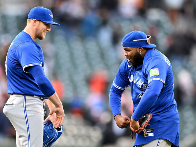 BALTIMORE, MARYLAND - APRIL 13: Jeff Hoffman #23 of the Toronto Blue Jays celebrates with Vladimir Guerrero Jr. #27 after a 7-6 victory against the Baltimore Orioles at Oriole Park at Camden Yards on April 13, 2025 in Baltimore, Maryland.