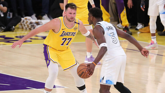 LOS ANGELES, CA - FEBRUARY 27: Los Angeles Lakers guard Luka Doncic (77) sits down to guard Minnesota Timberwolves guard Anthony Edwards (5) during the NBA game between the Minnesota Timberwolves and the Los Angeles Lakers on February 27, 2025, at Crypto.com Arena in Los Angeles, CA.
