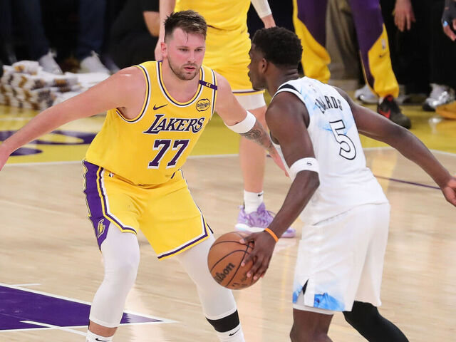 LOS ANGELES, CA - FEBRUARY 27: Los Angeles Lakers guard Luka Doncic (77) sits down to guard Minnesota Timberwolves guard Anthony Edwards (5) during the NBA game between the Minnesota Timberwolves and the Los Angeles Lakers on February 27, 2025, at Crypto.com Arena in Los Angeles, CA.