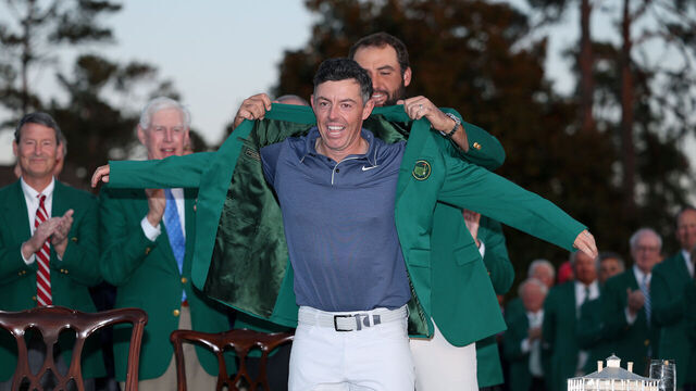 AUGUSTA, GEORGIA - APRIL 13: Rory McIlroy of Northern Ireland is awarded the Green Jacket by Masters Champion Scottie Scheffler after the final round of the 2025 Masters Tournament at Augusta National Golf Club on April 13, 2025 in Augusta, Georgia.