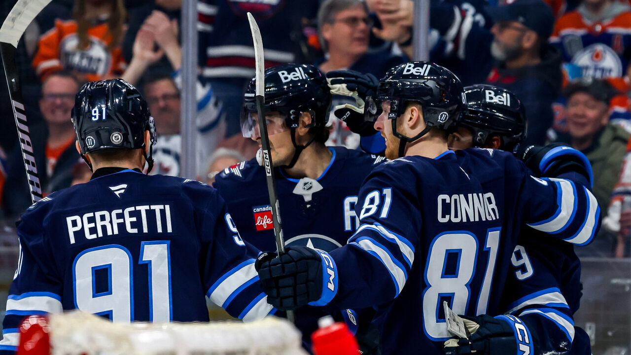 WINNIPEG, CANADA - APRIL 13: Cole Perfetti #91, Mark Scheifele #55, Kyle Connor #81 and Alex Iafallo #9 of the Winnipeg Jets celebrate a second period goal against the Edmonton Oilers at the Canada Life Centre on April 13, 2025 in Winnipeg, Manitoba, Canada.