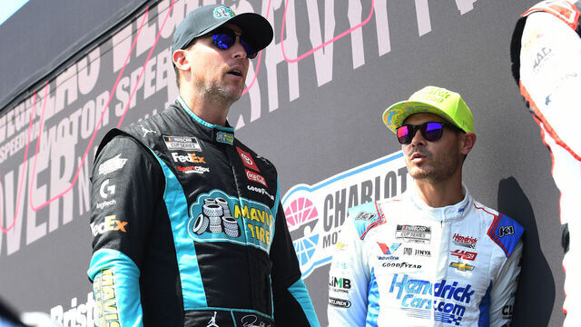 ATLANTA, GA - SEPTEMBER 08: Denny Hamlin (#11 Joe Gibbs Racing Mavis Tire Toyota) and Kyle Larson (#5 Hendrick Motorsports HendrickCars.com Chevrolet) talk prior to the running of the NASCAR Cup Series Quaker State 400 available at Walmart on September 08, 2024, at Atlanta Motor Speedway in Hampton, GA.
