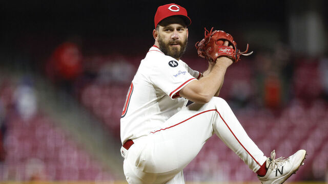 CINCINNATI, OHIO - MARCH 31: Sam Moll #50 of the Cincinnati Reds throws a pitch in the eighth inning against the Texas Rangers at Great American Ball Park on March 31, 2025 in Cincinnati, Ohio.
