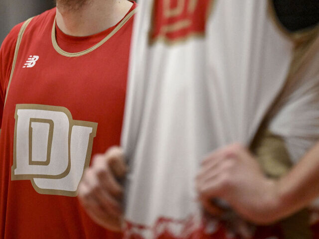 DENVER, CO - FEBRUARY 6: Touko Tainamo (25) stands with teammates during practice at Hamilton Gymnasium at DU on Tuesday, February 6, 2024.